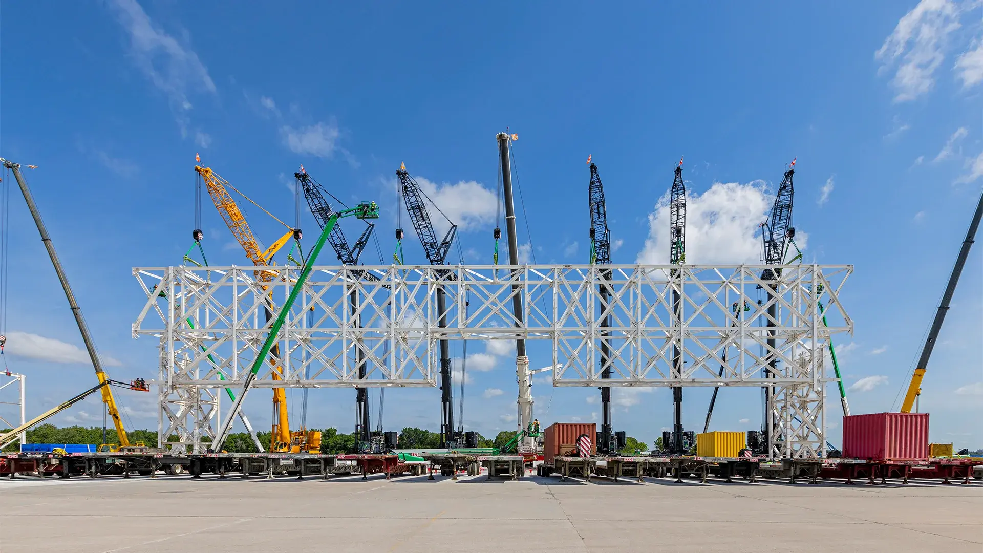 Truss lift by multiple construction cranes